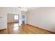 Bedroom with hardwood floors, a closet with mirrored doors, and a ceiling fan at 1828 Mova St, Sarasota, FL 34231