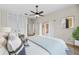 Bright bedroom showcasing a ceiling fan, access to the lanai, and closet space for ample storage at 1828 Mova St, Sarasota, FL 34231