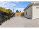 Large paved brick driveway leading to the rear gated entrance at 1828 Mova St, Sarasota, FL 34231