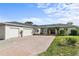 Charming single-story home featuring a three-car garage and beautiful landscaping at 1828 Mova St, Sarasota, FL 34231