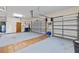Spacious two-car garage with ample storage, a refrigerator, and a door leading to the interior at 1828 Mova St, Sarasota, FL 34231
