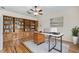 Bright home office featuring custom built-in shelving, a modern desk, and a comfortable workspace at 1828 Mova St, Sarasota, FL 34231