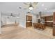 Open kitchen featuring an island with seating, stainless steel appliances, and hardwood cabinets at 1828 Mova St, Sarasota, FL 34231