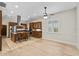 A kitchen with wood cabinets, granite counters, stainless appliances, and an island with seating at 1828 Mova St, Sarasota, FL 34231