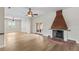 Bright living room showcasing hardwood floors, a decorative fireplace, and ample natural light at 1828 Mova St, Sarasota, FL 34231