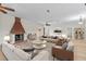 Stylishly furnished living room boasting a brick fireplace, hardwood floors, and contemporary decor at 1828 Mova St, Sarasota, FL 34231