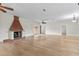 Large open-concept living room featuring hardwood floors, a fireplace, and abundant natural light at 1828 Mova St, Sarasota, FL 34231