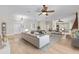 Bright, spacious living room with hardwood floors, ceiling fans, and elegant decor at 1828 Mova St, Sarasota, FL 34231