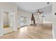 Bright living room with hardwood floors, fireplace, and view of the pool through sliding glass door at 1828 Mova St, Sarasota, FL 34231