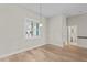 Bright room with hardwood floors, plantation shutters, and an en-suite bathroom at 1828 Mova St, Sarasota, FL 34231