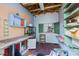 Image shows the interior of shed with shelves and a workspace; the perfect place for storage at 1828 Mova St, Sarasota, FL 34231