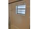 Bright bathroom featuring a window and glass enclosed shower at 205 46Th Avenue W Ter # 425, Bradenton, FL 34207