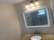 Bathroom vanity with granite counters, framed mirror and view of tiled shower at 205 46Th Avenue W Ter # 425, Bradenton, FL 34207