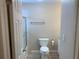 Clean, neutral-toned bathroom featuring a toilet, towel bar, and a shower with glass doors at 205 46Th Avenue W Ter # 425, Bradenton, FL 34207