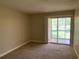 Bright bedroom with carpet and large window, ideal for relaxing at 205 46Th Avenue W Ter # 425, Bradenton, FL 34207