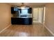 Open concept kitchen with breakfast bar featuring stainless steel appliances and tile flooring at 205 46Th Avenue W Ter # 425, Bradenton, FL 34207