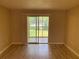 Bright living room featuring tile floors and access to outdoor patio through sliding glass doors at 205 46Th Avenue W Ter # 425, Bradenton, FL 34207
