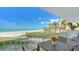 Charming balcony with seating, providing serene ocean views and coastal landscaping at 2301 Gulf Of Mexico Dr # 26N, Longboat Key, FL 34228