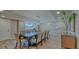 Large dining room with long table and views to outside at 2301 Gulf Of Mexico Dr # 26N, Longboat Key, FL 34228