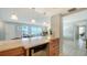 Kitchen with a wine cooler and stainless refrigerator, with views of the ocean at 2301 Gulf Of Mexico Dr # 26N, Longboat Key, FL 34228