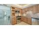 Kitchen features a stainless oven and microwave, and tile flooring at 2301 Gulf Of Mexico Dr # 26N, Longboat Key, FL 34228