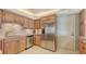 Kitchen featuring stainless steel appliances and neutral countertops and backsplash at 2301 Gulf Of Mexico Dr # 26N, Longboat Key, FL 34228