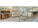 Cozy living room with beach views, comfortable seating, and a dining area in an open layout at 2301 Gulf Of Mexico Dr # 26N, Longboat Key, FL 34228