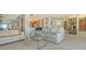 Bright living room that opens to the kitchen and features balcony access with beach views at 2301 Gulf Of Mexico Dr # 26N, Longboat Key, FL 34228