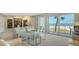 Inviting living room with balcony access featuring beach views and comfortable, stylish seating at 2301 Gulf Of Mexico Dr # 26N, Longboat Key, FL 34228