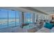 Bright, spacious living room with floor to ceiling windows and ocean views at 2301 Gulf Of Mexico Dr # 26N, Longboat Key, FL 34228
