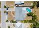 Aerial view of the house showcasing the roof, backyard, and the inviting in-ground pool at 2311 Sunnyside Pl, Sarasota, FL 34239