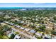 Wide aerial shot showcases the neighborhood with well-maintained homes and lush landscaping, offering a serene setting at 2311 Sunnyside Pl, Sarasota, FL 34239