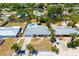 Aerial view of a home showcasing its lush surroundings and a private pool at 2311 Sunnyside Pl, Sarasota, FL 34239