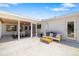 Spacious patio with outdoor seating area and a view of the screened-in porch at 2311 Sunnyside Pl, Sarasota, FL 34239