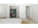 Bright bedroom featuring a closet with clothing and a sliding door at 2311 Sunnyside Pl, Sarasota, FL 34239