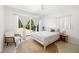 Bedroom with ample light with a jute rug and a patio exit at 2311 Sunnyside Pl, Sarasota, FL 34239