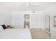 Bright bedroom with large closet and neutral walls at 2311 Sunnyside Pl, Sarasota, FL 34239