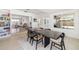 Open concept dining room showcasing neutral walls, hardwood floors, and views to the living area at 2311 Sunnyside Pl, Sarasota, FL 34239