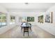 Bright dining room with large windows, a modern chandelier, and stylish decor at 2311 Sunnyside Pl, Sarasota, FL 34239