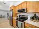 Modern kitchen with stainless steel appliances and light wood cabinets at 2311 Sunnyside Pl, Sarasota, FL 34239