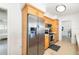 Bright kitchen with stainless steel refrigerator and wooden cabinetry at 2311 Sunnyside Pl, Sarasota, FL 34239