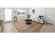 Bright living room with neutral decor, a jute rug, and ample natural light from the window at 2311 Sunnyside Pl, Sarasota, FL 34239