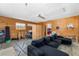 Cozy living room with exposed wood walls and plush seating area at 2311 Sunnyside Pl, Sarasota, FL 34239