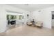 Open living space featuring tile floors and sliding glass doors leading to a dining area at 2311 Sunnyside Pl, Sarasota, FL 34239