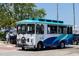 A clear, crisp view of the 'Breeze' tour bus in front of palm trees and clear, sunny skies at 2311 Sunnyside Pl, Sarasota, FL 34239