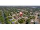 A high angle aerial view of a home in a neighborhood surrounded by mature trees and a waterway at 2366 Ann Arbor Rd, North Port, FL 34286