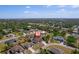 An aerial view shows the home situated in a verdant, established neighborhood at 2366 Ann Arbor Rd, North Port, FL 34286