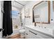 Bathroom featuring black and gold fixtures, tub/shower combo, and a white vanity at 2366 Ann Arbor Rd, North Port, FL 34286
