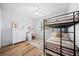 Bright bedroom with bunk beds, a desk, and wood floors at 2366 Ann Arbor Rd, North Port, FL 34286