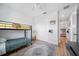 View of a neutral ' bedroom with a bunk bed, gray rug, and white closet at 2366 Ann Arbor Rd, North Port, FL 34286
